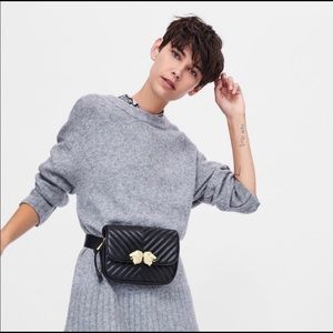 Black fanny pack and purse.